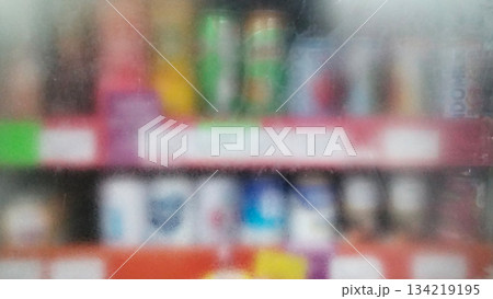 Blurry photo of bottled drinks on supermarket shelves 134219195
