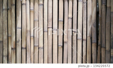 Bamboo fence wall panels with vertical polish create a rustic style wall. Bamboo fence wall panels with vertical polish create a rustic style wall. 134220372