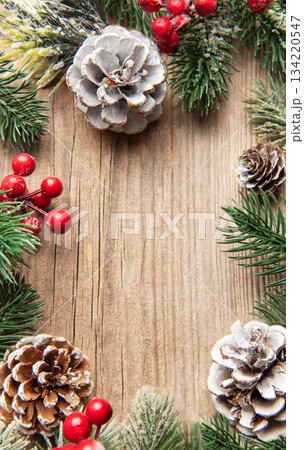 Christmas winter holiday frame on rustic wood background Christmas winter holiday frame on rustic wood background 134220547