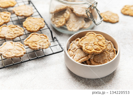 Homemade dog treats in paw print shape cooling and stored Homemade dog treats in paw print shape cooling and stored 134220553