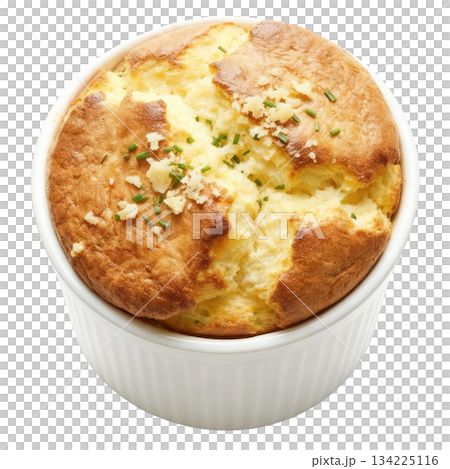 Warm, delicious savory cheese souffle, perfectly risen French food baked in white ramekin with fresh herbs 134225116