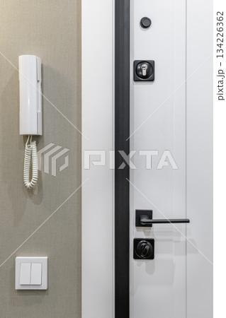Modern Apartment Entrance Door with Intercom and Light Switch Modern Apartment Entrance Door with Intercom and Light Switch 134226362