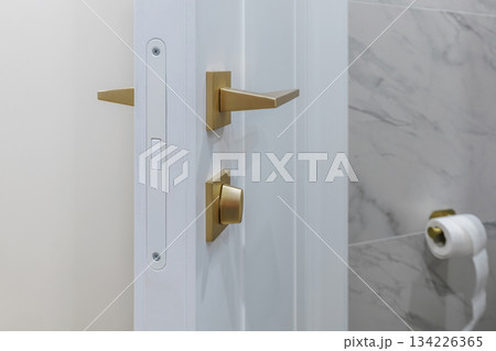 Modern White Door with Golden Handle in Bathroom Interior Modern White Door with Golden Handle in Bathroom Interior 134226365