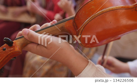 Russian folk group musician - woman play violin 134226506