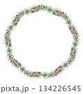 Tiny Christmas wreath of yew branches with pink berry in the circle shape. Hand painted textured watercolor. Pink and green create a soft winter mood. Good for festive frame template and card design. 134226545