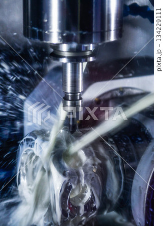 CNC milling machine cutting the mold parts with oil coolant method The mold and die manufacturing process by machining center with the solid ball endmill tools. 134229111