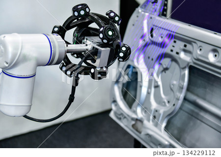 3D scanner on robotic arm measure the accuracy of large automotive parts. in industrial plants 134229112