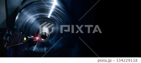 Rotary axis CNC milling machine during deburring of engine parts, heavy industry plan, copy space Rotary axis CNC milling machine during deburring of engine parts, heavy industry plan, copy space 134229118