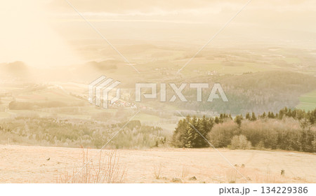 mountain in a magical fog on the Wasserkuppe in Rhoen Hesse Germany, mystical landscape under the fog, the fog creates an illusion 134229386