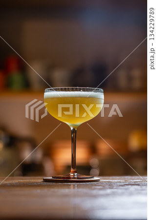Elegant cocktail with citrus foam 134229789