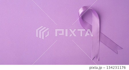 Lilac ribbon on purple background. Lilac ribbon on purple background. 134231176