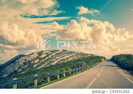 Driving a car on a mountain winding road in National park Picos de Europa. Spain, Europe 134231202