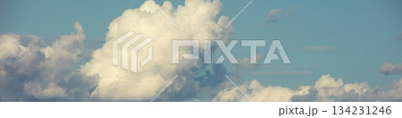 Blue sky with clouds. Cloudy sky background. Horizontal banner 134231246