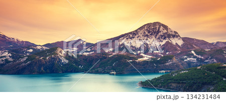 Mountain lake in autumn Aerial view. Serre-Poncon mountain lake during sunset in winter in Hautes Alpes, France Mountain lake in autumn Aerial view. Serre-Poncon mountain lake during sunset in winter in Hautes Alpes, France 134231484