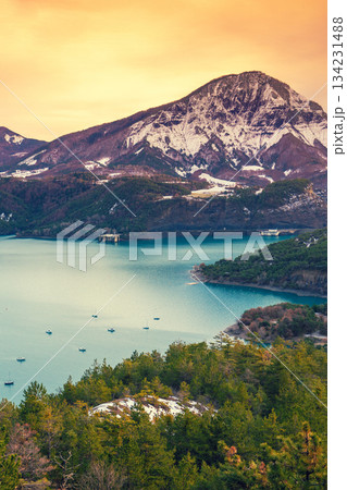Mountain lake in autumn Aerial view. Serre-Poncon mountain lake during sunset in winter in Hautes Alpes, France 134231488