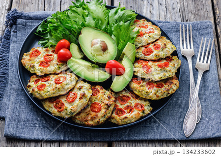 minced chicken cherry tomatoes patties on a plate minced chicken cherry tomatoes patties on a plate 134233602
