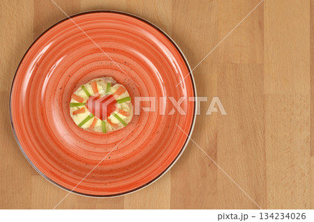 Appetizer on Orange Plate 134234026