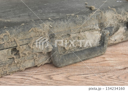 dust and dirty old black briefcase lock by coding number on table 134234160