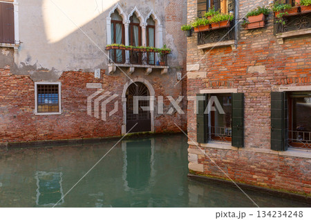 Canal with traditional buildings in Venice Italy Canal with traditional buildings in Venice Italy 134234248