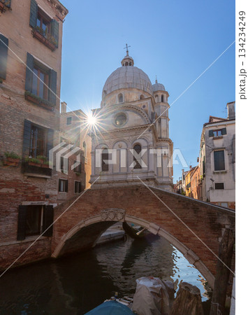 Bridge and church dome view in Venice Italy Bridge and church dome view in Venice Italy 134234249