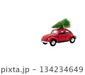 toy retro red car with a christmas tree on the roof, beautiful christmas card isolated on white copy space for the text 134234649