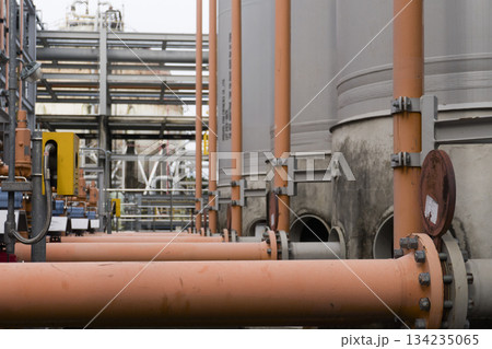 Large industrial plant with many pipes and tanks Large industrial plant with many pipes and tanks 134235065