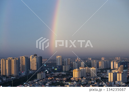 Rainbow is seen in the sky above a city Rainbow is seen in the sky above a city 134235087