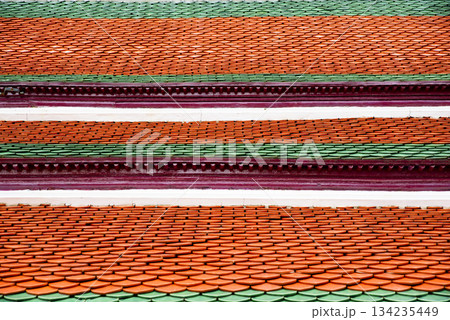 Red and green roof with a pattern of orange tiles Red and green roof with a pattern of orange tiles 134235449