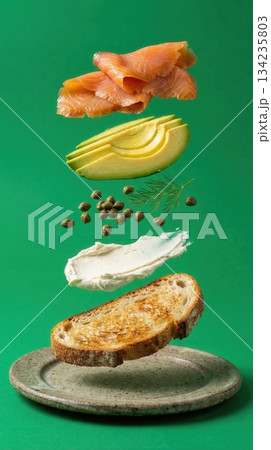 Deconstructed Salmon And Avocado Toast Ingredients green background 134235803
