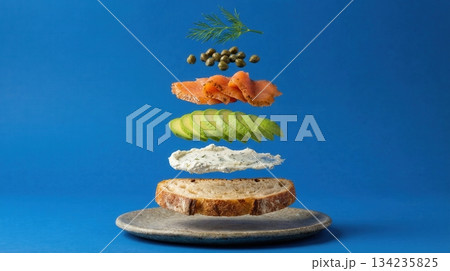 Deconstructed Salmon And Avocado Toast Ingredients blue background Deconstructed Salmon And Avocado Toast Ingredients blue background 134235825
