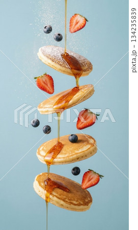 Flying Stack Of Pancakes With Berries And Honey Syrup Art 134235839