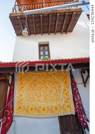 Turkish old house with yellow carpet and wooden balconies. 134236444