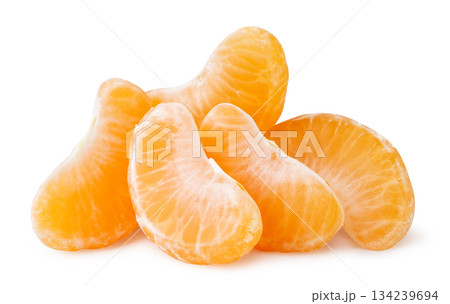 Pile of tangerine slices close-up on a white background. Isolated 134239694