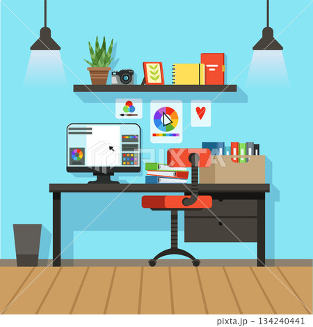 A computer desk with a red chair and a computer monitor 134240441