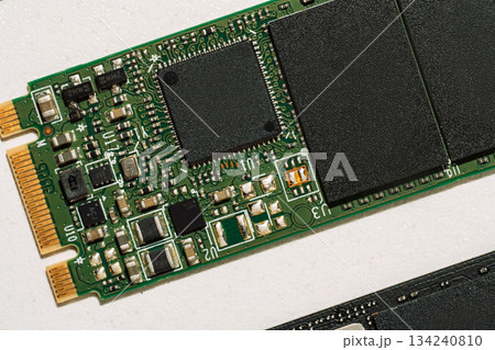 Macro of green M.2 SSD controller and electronic components Macro of green M.2 SSD controller and electronic components 134240810