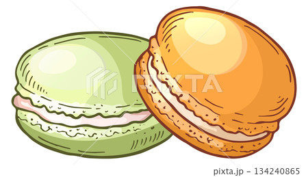 Two macarons with one being green and the other being orange 134240865