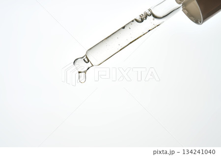 Cosmetic serum dropper applying essential liquid oil 134241040