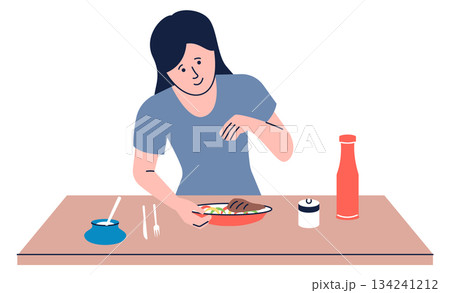 A woman is sitting at a table with a plate of food in front of her 134241212