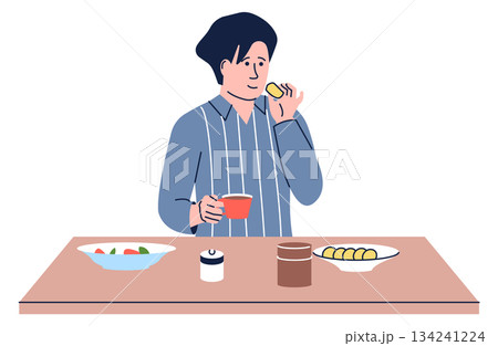 A man is sitting at a table with a bowl of salad and a cup of coffee 134241224