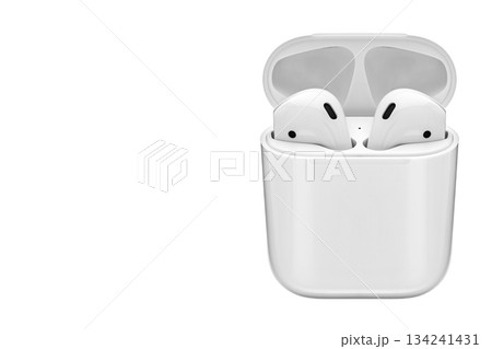 A pair of white earbuds are sitting on a white background A pair of white earbuds are sitting on a white background 134241431