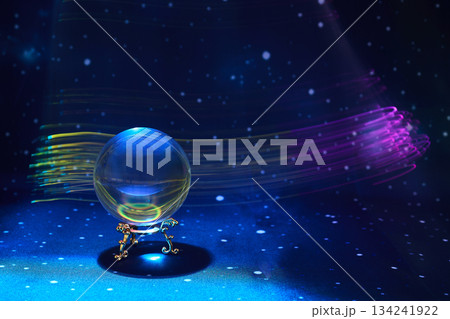 Magical Orb in Space. A glowing orb rests on an ornate stand, surrounded by cosmic light streaks Magical Orb in Space. A glowing orb rests on an ornate stand, surrounded by cosmic light streaks 134241922