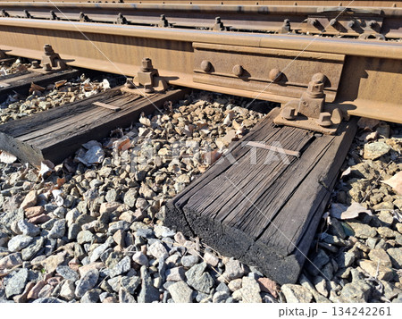 Elements of tram rail system, old wooden sleepers and rusty rails 134242261