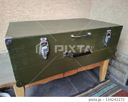 An old green wooden chest with two handles 134242272