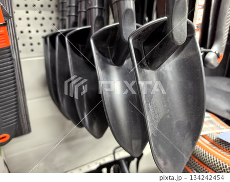 Shovels lined up for gardening tasks in a home improvement store 134242454