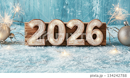 Big wooden numbers 2026 with glittering silver decorations and sparklers for festive New Year card Big wooden numbers 2026 with glittering silver decorations and sparklers for festive New Year card 134242788