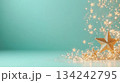 Festive gold star decorations with twinkling lights on teal background with empty space 134242795