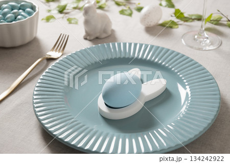 Easter plate with blue egg and bunny holder Easter plate with blue egg and bunny holder 134242922