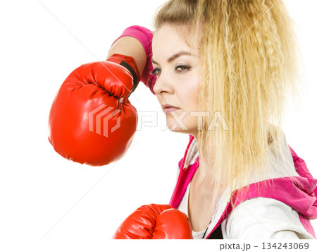 Woman wearing boxing gloves Woman wearing boxing gloves 134243069