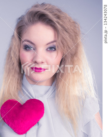 Woman having pink heart Woman having pink heart 134243078