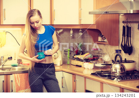Woman holding cup of tea of coffee Woman holding cup of tea of coffee 134243201